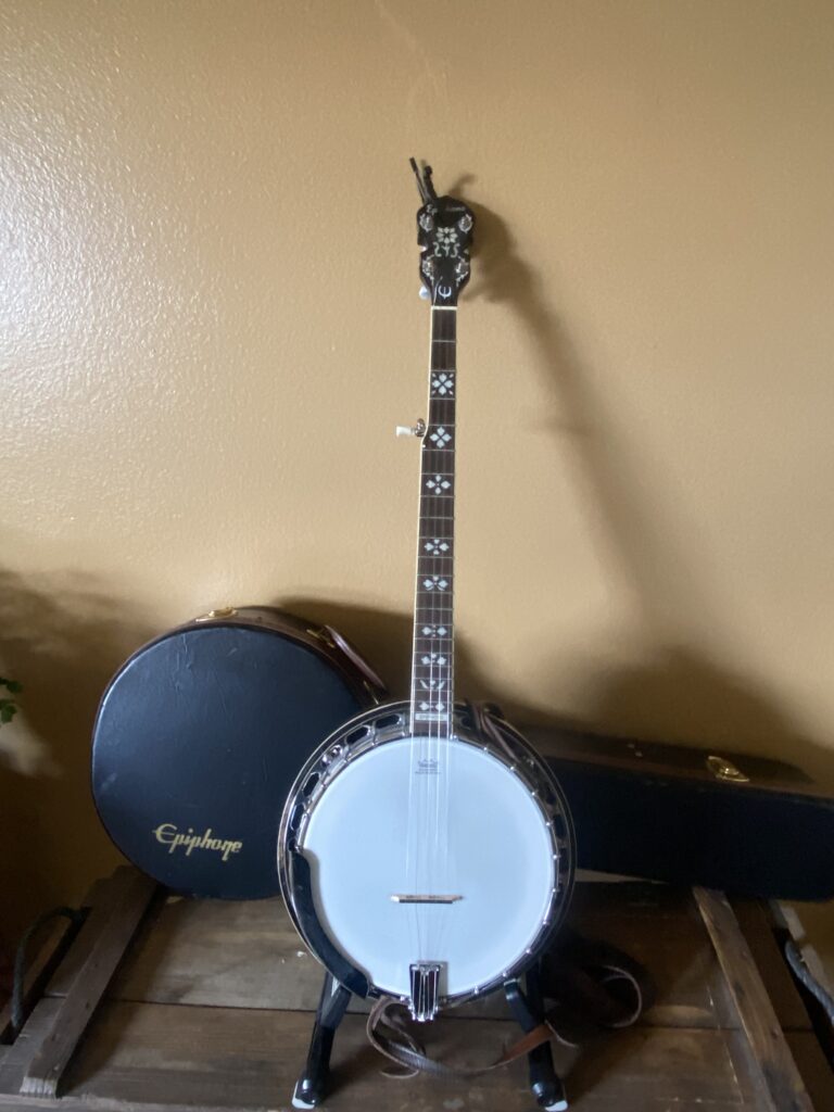 2011 Epiphone resonator banjo - Comes with hard case, finger picks, strap and capo.